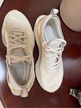 Nike Women's White Sneakers with Gold Trim